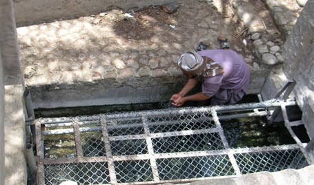 Figure 15 - A workers Alpiedar, of Falaj SAROOJ the water is used for drinking picture was taken in 2005